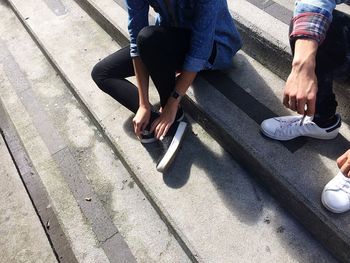 Low section of woman on tiled floor