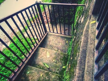 High angle view of footpath by railing