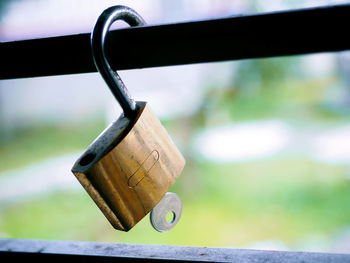 Close-up of padlocks on railing