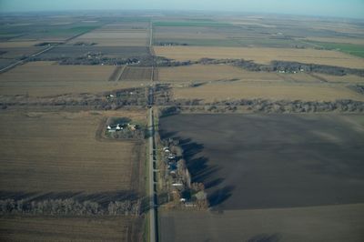 Aerial view of agricultural landscape against sky