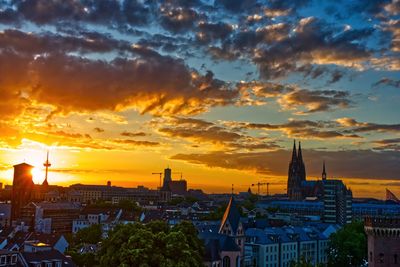 Cityscape against sky during sunset