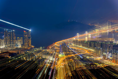 High angle view of illuminated city buildings at night