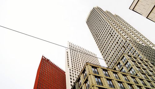 Low angle view of skyscrapers against clear sky