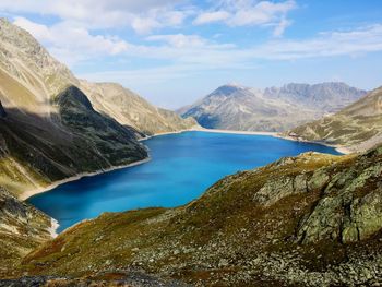 Scenic view of mountains against cloudy sky