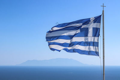 Low angle view of flag against sky