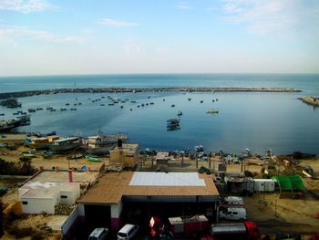 High angle view of people on shore against sky