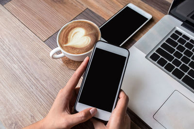 High angle view of coffee cup on table