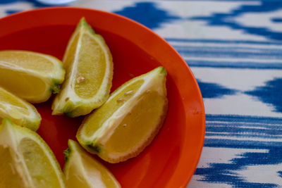 High angle view of fruits in plate on table
