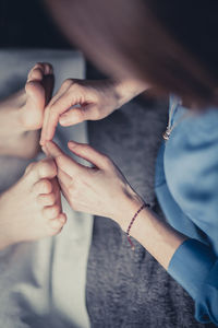 Midsection of woman holding hands