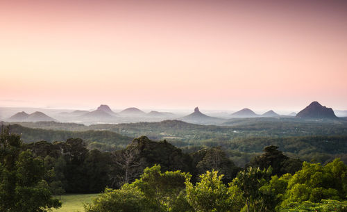 Scenic view of glass house mountains against clear sky