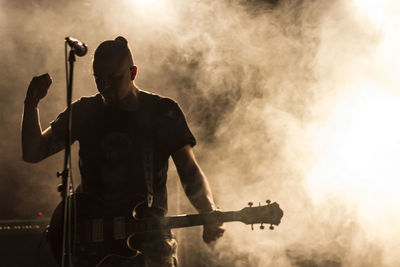 Man playing guitar on stage