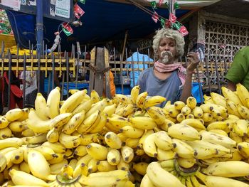 Man selling fruits at market stall