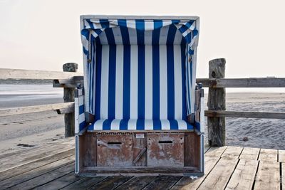 Built structure on beach against clear sky