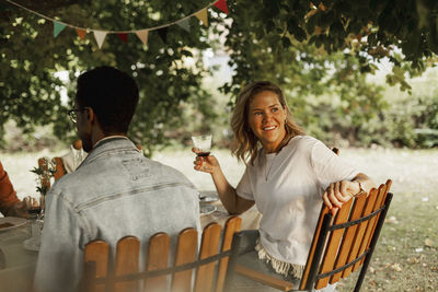 Two people sitting in a drinking glass