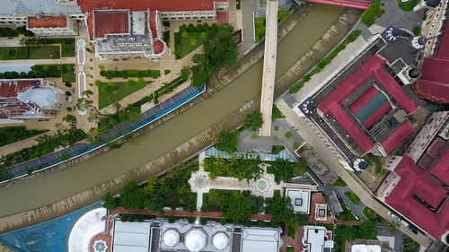 High angle view of canal amidst buildings in city