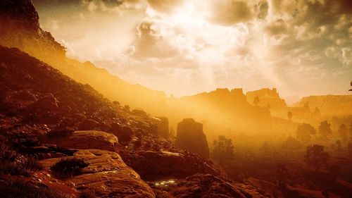 Scenic view of mountains against sky during sunset