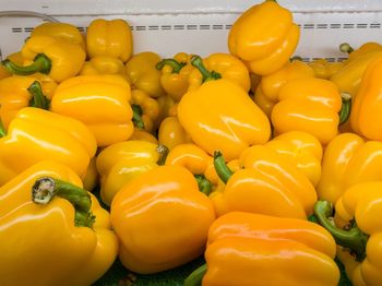 Close-up of yellow bell peppers for sale in market