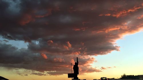 Low angle view of cloudy sky at sunset