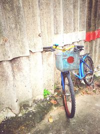 Bicycle parked against wall