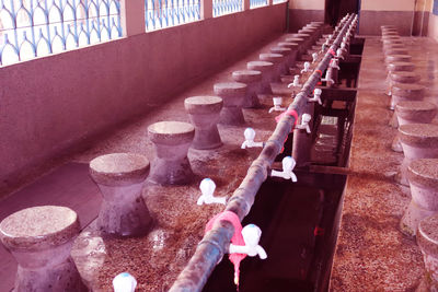Close-up of lit candles on staircase in temple