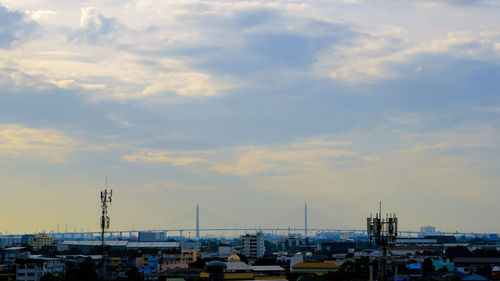 Sailboats in city against sky