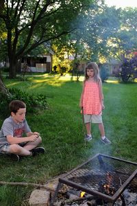 Full length of mother and girl in yard