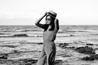 Woman standing on beach