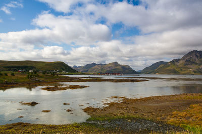 Scenic view of lake and mountains against sky