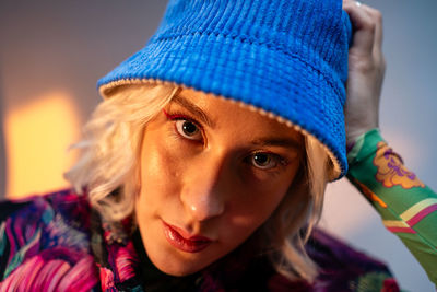Portrait of young woman wearing hat