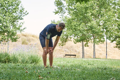 Man rests after exercise. he rests his hands on his knees. concept of healthy life and sport.