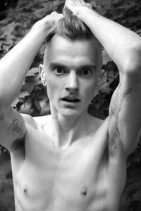 Portrait of young shirtless man