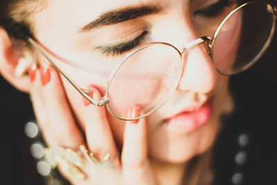 Close-up of woman wearing eyeglasses