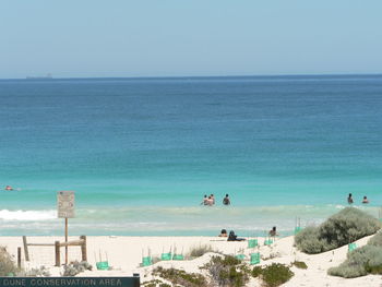 Scenic view of beach against clear sky