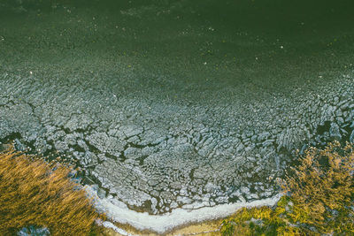 Aerial view of frozen lake during winter