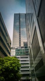 Low angle view of office building against sky