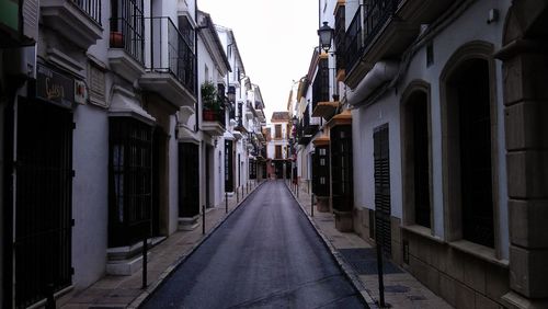 Narrow alley amidst buildings in city