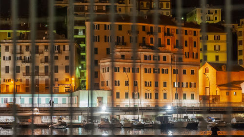 Reflection of buildings in city at night