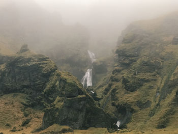 Scenic view of mountains in foggy weather