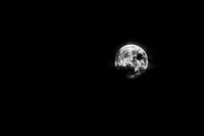 Illuminated moon in sky at night