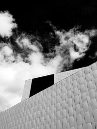 Low angle view of building against cloudy sky