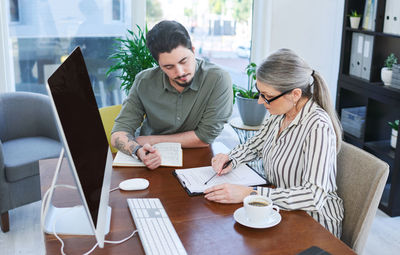 Business colleagues working on table