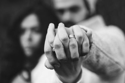 Close-up of hands holding flower