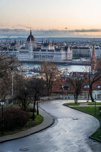 Road passing through city during winter