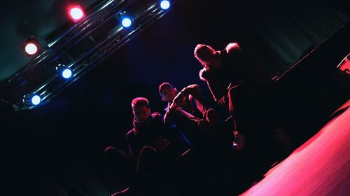 Low angle view of crowd at music concert