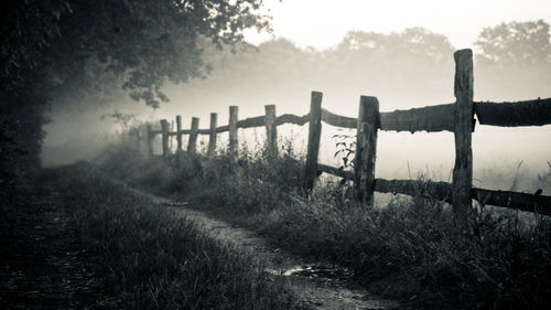 Wooden fence on field