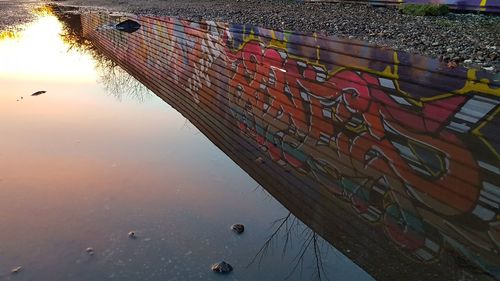 Multi colored boats moored in water