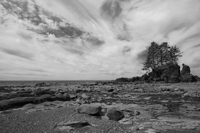 Rocks on shore against sky