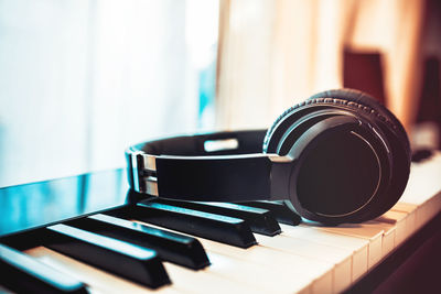 Close-up of piano keys on table at home