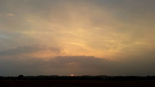 Scenic view of landscape against sky during sunset