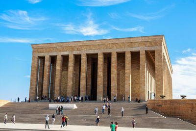 Group of people in front of historical building